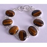 A SILVER TIGERS EYE BRACELET. 16 cm long.