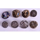 EIGHT VINTAGE BUTTONS some silver. (8)