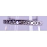 A 9CT WHITE GOLD AND DIAMOND ETERNITY RING. Size M.