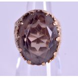 A 9CT GOLD SMOKEY QUARTZ RING. Size F.