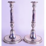 A PAIR OF 19TH CENTURY CONTINENTAL SILVER CANDLESTICKS decorated neo classical motifs. 19 oz. 26 cm