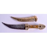 A MIDDLE EASTERN BRASS AND BONE DAGGER. 27 cm long.