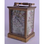 AN EARLY 20TH CENTURY FRENCH REPEATING BRASS CARRIAGE CLOCK inset with Aesthetic movement porcelain