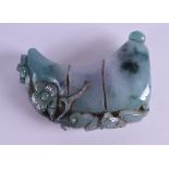 A CHINESE CARVED ICEY JADEITE AMULET. 8.5 cm x 6.5 cm.