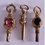 THREE VICTORIAN GEM SET WATCH FOBS. (3)