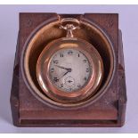 A 9CT GOLD STAYTE POCKET WATCH upon a stand. 46.6 grams overall. 4.25 cm wide.