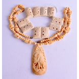 A CARVED BONE NECKLACE together with a bone bracelet. (2)