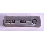 A CHINESE WHITE METAL INGOT. 161 grams. 8 cm wide.