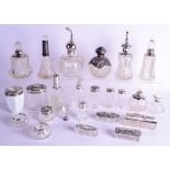 A GROUP OF TWENTY FOUR SILVER TOPPED JARS AND BOTTLES including a fine crystal and silver seal. (24)