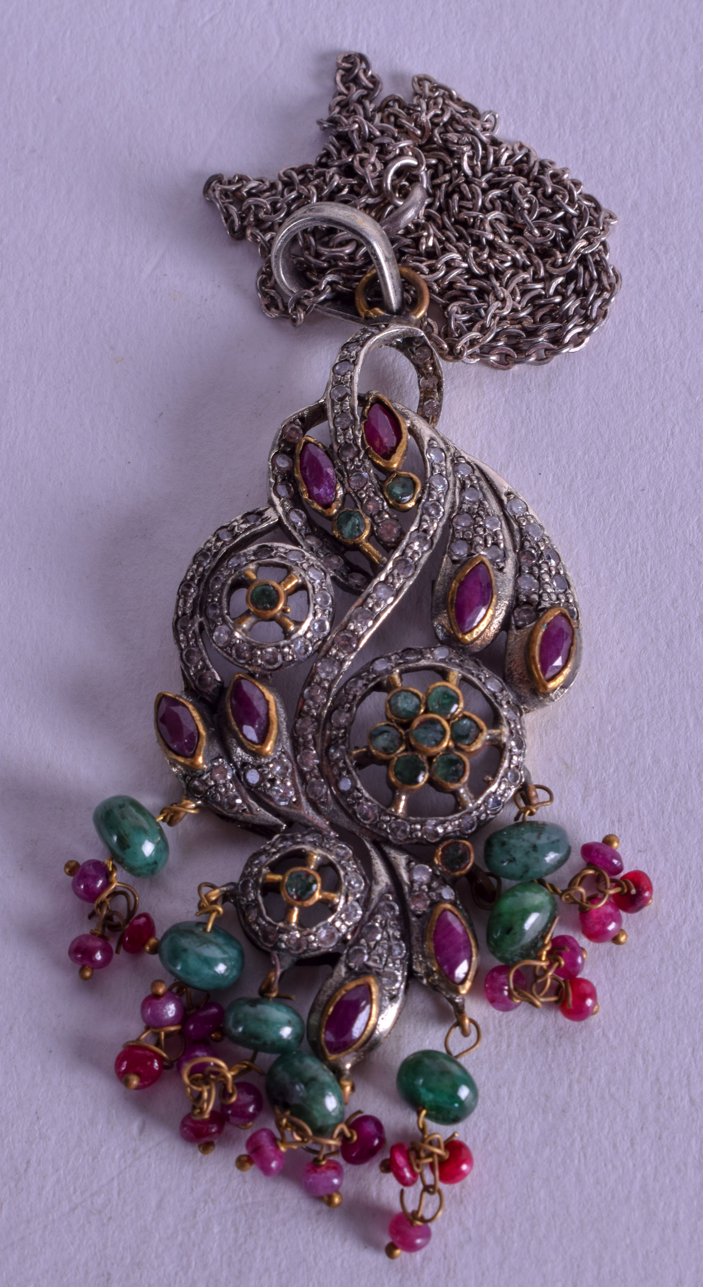 A SILVER EMERALD AND RUBY PENDANT. 17 grams.