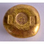 A CHINESE YELLOW METAL INGOT. 102 grams. 3.25 cm wide.