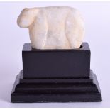 AN EARLY CENTRAL ASIAN CARVED STONE IDOL in the form of a cow. 5.5 cm wide.