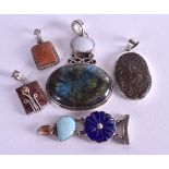 FIVE VINTAGE SILVER PENDANTS. 109 grams. (5)