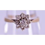 A 9CT GOLD DIAMOND CLUSTER RING. Size L.