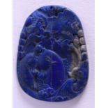 A CHINESE CARVED LAPIS LAZU PENDANT. 4.5 cm x 5.5 cm.