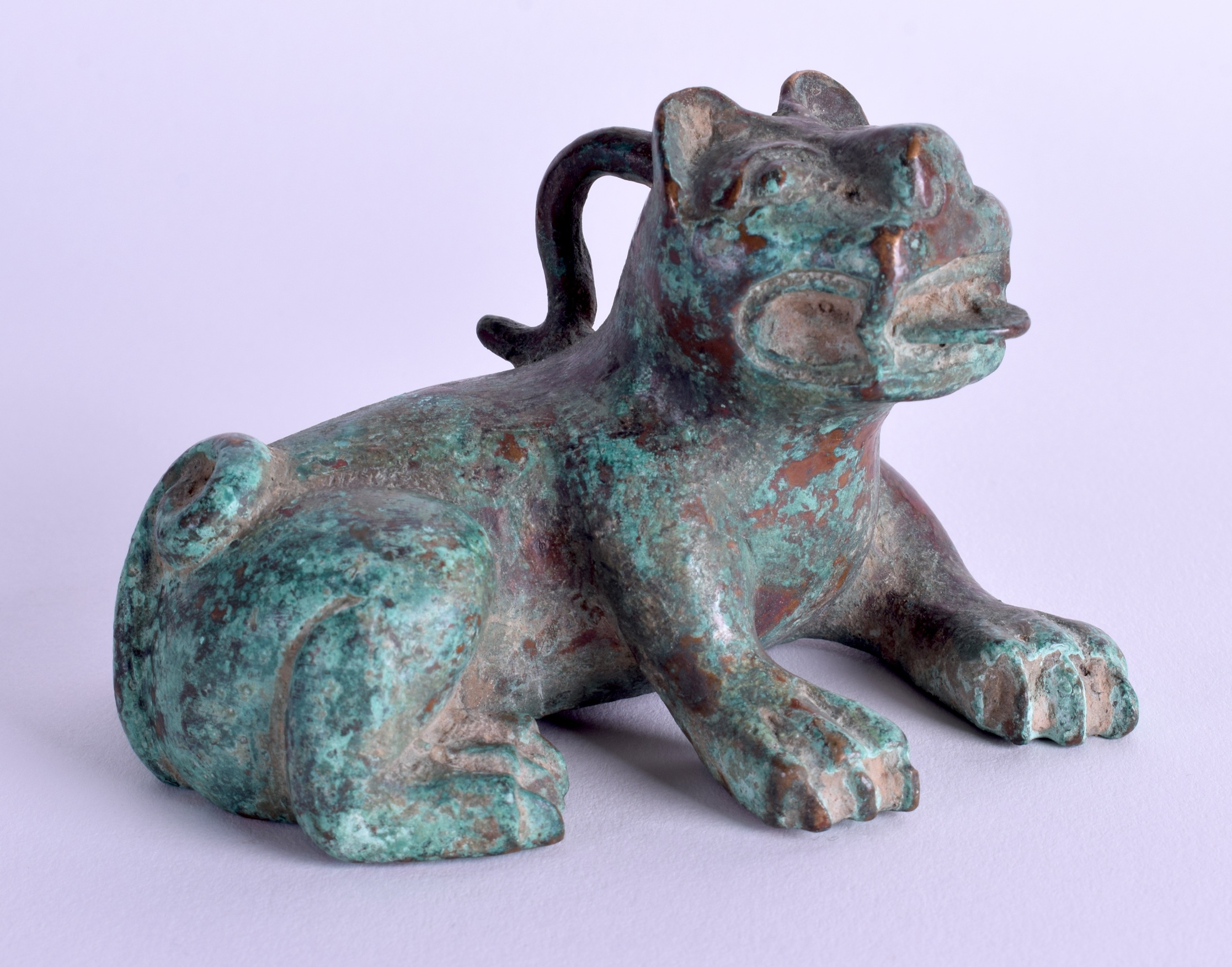 A CHINESE BRONZE SCROLL WEIGHT modelled as a beast. 9 cm wide.