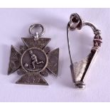 AN ANTIQUE SILVER FOOTBALLMEDAL together with a silver brooch. (2)