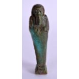 AN EARLY EGYPTIAN FAIENCE GLAZED USHABTI. 10 cm high.