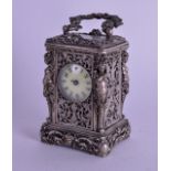 A 19TH CENTURY MINIATURE EUROPEAN SILVER PLATED CARRIAGE CLOCK of figural form. 8 cm high inc handle