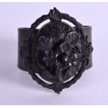 A VICTORIAN CARVED JET BANGLE. 6 cm wide.