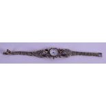 AN UNUSUAL SILVER LADIES WRISTWATCH. 1.5 cm wide.