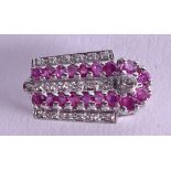 AN 18CT WHITE GOLD AND PINK SAPPHIRE BROOCH. 6.2 grams.