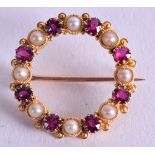 A VICTORIAN 18CT GOLD RUBY AND PEARL BROOCH. 4.7 grams. 2.75 cm wide.