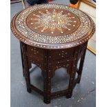 AN EARLY 20TH CENTURY MIDDLE EASTERN WOODEN TABLE OR STAND, inlaid with bone forming extensive folia