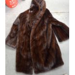 A LADIES VINTAGE FUR COAT.