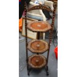 AN EARLY 20TH CENTURY ISLAMIC THREE TIER CAKE STAND, inlaid with floral decoration. 79 cm high.