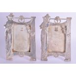 A PAIR OF ART NOUVEAU SILVER PLATED PHOTOGRAPH FRAMES in the manner of WMF. 17 cm x 25 cm.