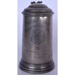 A 19TH CENTURY PEMBROKE COLLEGE PEWTER TANKARD, engraved with crest and dated 1886. 22 cm high.