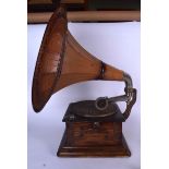 A LARGE ANTIQUE GRAMOPHONE, decorated with a white metal plaque. 69 cm high.