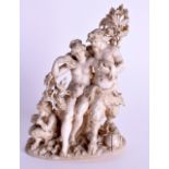 A 19TH CENTURY EUROPEAN CARVED IVORY FIGURE OF SATYR modelled beside a nude female. 12 cm x 8 cm.