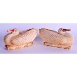 A PAIR OF 19TH CENTURY CHINESE CARVED IVORY BOXES AND COVERS in the form of a stylised ducks upon na