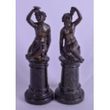 A PAIR OF 19TH CENTURY FRENCH BRONZE FIGURES OF FEMALES modelled upon marble columns. 12 cm high.