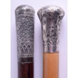 A VICTORIAN SILVER HANDLED AND MALACCA WALKING CANE together with another silver handled Indian cane