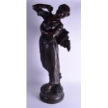 A LARGE 19TH CENTURY FRENCH BRONZE FIGURE OF A FEMALE by Gauguis, modelled as a female carrying grap