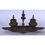 AN EARLY 20TH CENTURY FRENCH DOUBLE INKWELL BRONZE DESK STAND, decorated with extensive foliage. 43