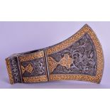 A MIDDLE EASTERN PERSIAN GOLD INLAID STEEL AXE HEAD decorated with figures and birds. 14 cm x 8 cm.