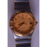 A BOXED 9CT GOLD OMEGA STAINLESS CONSTELLATION WRISTWATCH. 3.25 cm wide.