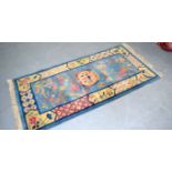 A CHINESE TASTE ART DECO NICHOLS RUG, decorated with precious object, “Made in China” verso