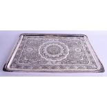 AN EARLY 20TH CENTURY PERSIAN SILVER MIDDLE EASTERN RECTANGULAR TRAY decorated all over with foliage