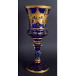 A RARE LARGE 18TH CENTURY BOHEMIAN GLASS GOBLET highlighted in gilt with scrolls and foliage. 27 cm