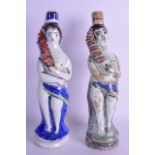 A RARE PAIR OF LATE 19TH CENTURY PERSIAN FAIENCE QAJAR BOTTLE FLASKS of figural form. 33 cm high.