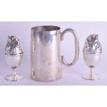 A PAIR OF SILVER PLATED BIRD EGG CUPS AND COVERS together with a silver tankard. Silver 12.8 oz. (3)