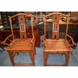 A PAIR OF EARLY 20TH CENTURY CHIENSE SOFTWOOD CHBAIRS with carved greek key type backsplat. 116cm hi