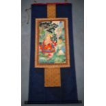 A RARE 19TH CENTURY CHINESE KESI SILK WORK THANGKA modelled as a seated buddhistic figure within lan