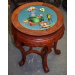 AN EARLY 20TH CENTURY CHINESE HARDWOOD STAND, inset with cloisonne panel, depicting precious objects