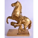 AN EARLY 19TH CENTURY FRENCH EMPIRE ORMOLU FIGURE OF A HORSE C1820 modelled beside a putti. 28 cm x